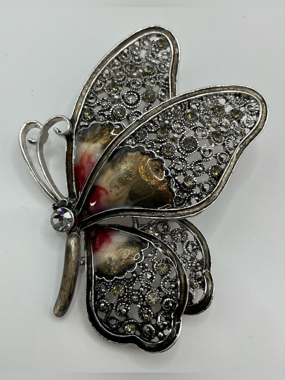 SILVERTONE LARGE FILAGREE BUTTERFLY BROOCH WITH RED AND GOLD ACCENTS NWOT